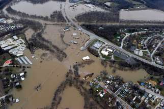 Submerged roads and houses are seen Dec. 28 after several days of heavy rain led to flooding in Union, Mo. Pope Francis called on Christians to pray for victims of several natural disasters that have hit parts of the United States, Great Britain and Paraguay.