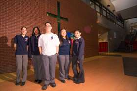 Students from Toronto’s Senator O’Connor College School stand in their school foyer. According to Ontario’s Ministry of Education data, more than 80% of English Catholic high school students graduate in four years compared to the 69% of student graduates in English public boards.