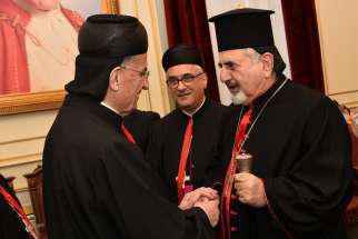 Lebanese Cardinal Bechara Rai, patriarch of the Maronite Catholic Church, and Syriac Catholic Patriarch Ignace Joseph III Younan share Christmas greetings Dec. 24, 2018, in Bkerke, Lebanon. To support the faithful and encourage them to stay in their homeland, the Syriac Catholic Church has reestablished a diocese for the Kurdistan region of Iraq.