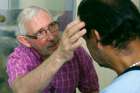 A priest administers the Sacrament of the Anointing of the Sick. Alberta and NWT bishops will withhold the sacrament from those requesting assisted suicide.