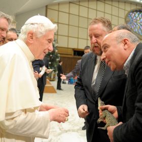 A member of Rome&#039;s Biopark zoo shows Pope Benedict XVI a rare young Cuban crocodile during the pope&#039;s weekly audience in Paul VI hall at the Vatican Jan. 11. The crocodile is set to be introduced to its natural habitat in Cuba during the Pope&#039;s trip in March. 