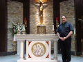 Fr. Joseph Grima stands by the altar containing a bone belonging to St. Maria Goretti at St. Francis of Assisi parish in Mississauga, Ont.