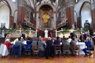 Pope Francis speaks during lunch with the poor, refugees and detainees in the Basilica of San Petronio in Bologna, Italy, Oct. 1.