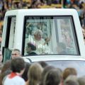 Pope Benedict XVI waves to the crowd as he arrives in his popemobile to celebrate Mass at Berlin&#039;s Olympic Stadium Sept. 22. The Vatican said the Pope greeted with a smile the news that a German citizen had filed a complaint against him for not wearing a seat belt in his popemobile during his visit to his homeland.