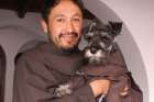 Friar Carmelo the dog with Franciscan Friar Jorge Fernandez in Cochabamba, Bolivia.