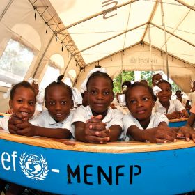 In post-earthquake Port-au-Prince, Haiti, the Canadian Catholic Organization for Development and Peace has changed the way it delivers aid. That means these girls from Immaculate Conception School — seen here in late 2010 in their temporary school — have ended up with a new school from the $20 million donated to earthquake relief to Development and Peace.