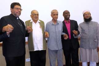 Port of Spain Archbishop Jason Gordon poses for a photo with other faith leaders June 11. Also pictured are Hindu Satnarayan Maharaj, Imam Yacoob Ali, evangelical Desmond Austin and Mufti Mohammed Haque.