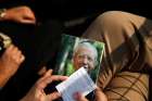 A woman holds an image of Blessed Alvaro del Portillo during his beatification ceremony in Madrid Sept. 27. Tens of thousands of people from around the world attended the beatification Mass for the former Opus Dei leader, who died in 1994.