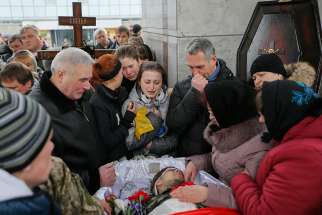 Ukrainians attend a funeral in Kiev Feb. 2 for a serviceman killed in the eastern Ukrainian conflict with Russia.