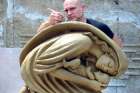 Timothy Schmalz puts some finishing touches on the original model for the ‘Maternal Bond’ sculpture. The sculpture is on exhibit at the Museum of the Bible in Washington, D.C. The museum has also commissioned him to do a Nativity scene, which he began forming from clay earlier this month.