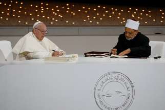  02.07.2019  Pope Francis and Sheik Ahmad el-Tayeb, grand imam of Egypt&#039;s al-Azhar mosque and university, sign documents during an interreligious meeting at the Founder&#039;s Memorial in Abu Dhabi, United Arab Emirates, Feb. 4, 2019. The pope and Sheik el-Tayeb stepped into a theological debate on the will of God toward religions when they signed a document on &quot;human fraternity&quot; and improving Christian-Muslim relations. 