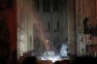 Smoke rises around the altar inside Notre Dame Cathedral in Paris as a fire continues to smolder early April 16, 2019. Officials said the cause was not clear, but that the fire could be linked to renovation work. 