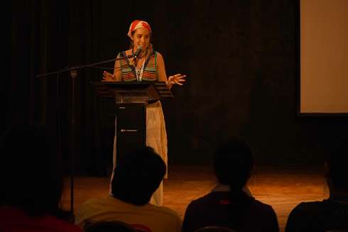 Esther Carmona Wagner speaks to pilgrims during the Catholic Christian Outreach session at Anita Villalaz Theatre in Panama City. 