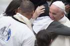 Pope Francis embraces a patient with Huntington&#039;s disease during the pontiff&#039;s general audience in St. Peter&#039;s Square at the Vatican May 17.