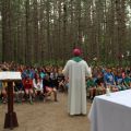 Bishop Douglas Crosby of the diocese of Hamilton celebrates Mass surrounded by forest at Camp Brébeuf, which has served children for more than 70 years.