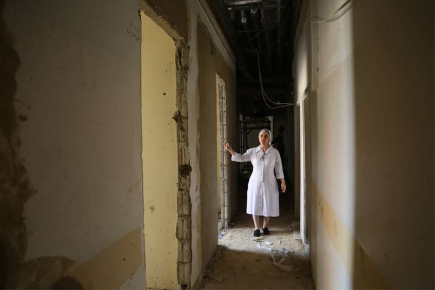 Sister Jeannette El Achkar gestures as she shows a part of Lebanese Hospital Geitaoui still under construction in Beirut Oct. 12, 2021. The health care sector in Lebanon is being crushed under the weight of multiple crises that are only getting worse, say the co-administrators of one of Lebanon&#039;s most important hospitals.
