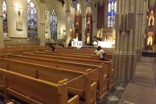 Pews were roped off and tape placed on the floor to ensure physical distancing as the first public Mass in three months was held at St. Michael’s Cathedral in Toronto on June 17.