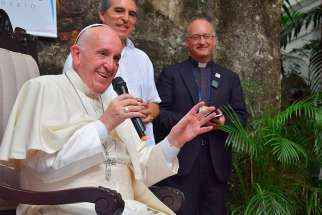 Pope Francis speaks during a meeting with Jesuits and laypeople associated with Jesuit institutions in Cartagena, Colombia, Sept. 10. While replying to questions, the pope said that seeking to understand people&#039;s real lives does not &quot;bastardize&quot; theology. In the background is Jesuit Father Antonio Spadaro, editor of the Rome-based Jesuit journal, La Civilta Cattolica. 