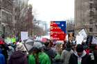 Protestors hold signs in Washington prior to the start of U.S. President Donald Trump&#039;s swearing-in as the country&#039;s 45th president Jan. 20. 