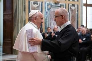 Pope Francis greets Canadian Father Michael Brehl, superior general of the Redemptorists, as the pope leads an audience with students and staff of the Alphonsian Academy at the Vatican Feb. 9, 2019.