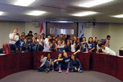 Roy Fernandes (wearing tie) joins St. Sylvester students having some fun with Toronto councillor Jim Karygiannis during a trip to City Hall. 