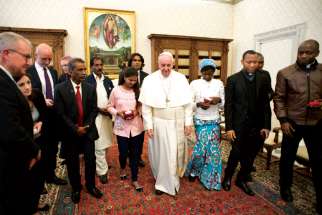 Pope Francis walks with family members of Asia Bibi, a Christian woman who will start a new life in Canada after being released from prison in Pakistan on blasphemy charges that carried a death sentence, during a private audience at the Vatican last February. 