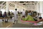 A general view shows South Sudanese patients Dec. 11 inside the surgery ward at the Bor teaching hospital after renewed conflict in Bor, South Sudan. Marking a year since South Sudan&#039;s latest war began, a Sudanese archbishop said the fighting has had a bitter impact on the nation, with communities sharply divided along ethnic lines.