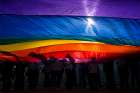 In this 2015 file photo, supporters for same-sex marriage wave a flag outside the U.S. Supreme Court in Washington.