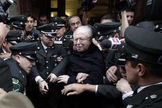 Chilean Father Fernando Karadima leaves after attending a 2015 hearing at the Supreme Court building in Santiago.