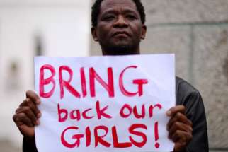 A protester holds a sign during a May 8 march in Cape Town, South Africa, in support of the girls kidnapped in Nigeria. Fr. John Bakeni, secretary of the Roman Catholic Diocese of Maiduguri, expressed doubts about the negotiations between the Nigerian government and the militant group Boko Haram from he release of 200 abducted school girls.