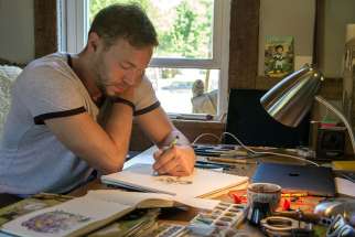 Catholic cartoonist Ben Hatke sketches his character &quot;Zita the Spacegirl&quot; in a studio in his Front Royal, Va., home May 17. His graphic novel series features a character who was named in honour of St. Zita.