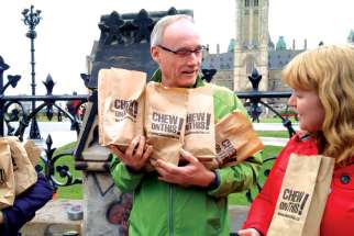 Citizens for Public Justice executive director Joe Gunn, left, seen on Oct. 6 raising awareness of poverty issues in the final week of the federal election campaign. Gunn is pleased an end is coming to special audits of charities