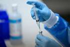 A health care worker prepares a dose of the COVID-19 vaccine at a clinic in Montreal March 15, 2021. &quot;Since there is currently no choice of COVID-19 vaccines being offered in Canada, Catholics, in good conscience may receive the vaccine that is available and offered to them,&quot; the Canadian Conference of Catholic Bishops said.