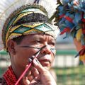 An indigenous woman paints her friend&#039;s face during the People&#039;s Summit in Rio de Janeiro June 16. The summit is a parallel event of the U.N. Rio+20 Conference on Sustainable Development June 20-22.