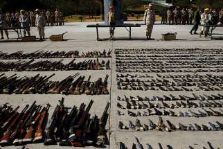 Weapons seized from criminal gangs are displayed before being destroyed by military personnel at a military base in Tijuana, Mexico, on August 12, 2016.