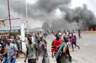 Opposition supporters in Kinshasa, Congo, chant slogans during a Sept. 19 march to press Congolese President Joseph Kabila to step down.