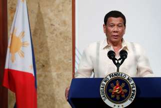  Philippine President Rodrigo Duterte is seen in Seoul, South Korea, June 5. During a technology summit in the southern city of Davao, Philippines, June 22, he questioned how Adam and Eve brought about &quot;original sin.&quot; 