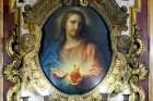 A painting by Pompeo Batoni of the Sacred Heart of Jesus from 1767 is displayed in an ornate frame inside the Jesuit Church of the Gesù in Rome, Oct. 22, 2024.