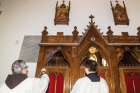 Fr. Jimmy Zammit blesses the 148-year-old stations of the cross newly installed in St. Francis of Assisi Parish. The stations from a Belgian convent no longer in use form part of a massive renovation of the 1906 church.