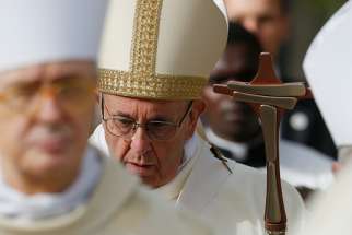  Pope Francis walks in procession as he celebrates Mass at St. Paul of the Cross Parish in Rome April 15. 