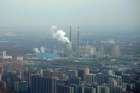 A thermal power plant is seen Nov. 21 near residential buildings in Beijing. As government delegations from across the globe prepare for a Dec. 2-14 U.N. conference on climate change, Catholic organizations are urging radical steps and pledging to make the church&#039;s voice heard.