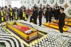 A man in Jinhua, China, lies in a coffin March 27, 2019, during an event organized by the local government to promote &quot;Tomb Sweeping Day.&quot; Christian funerals outside of churches have been banned in some areas of China as the communist government begins to enforce a new regulations on religious practices.