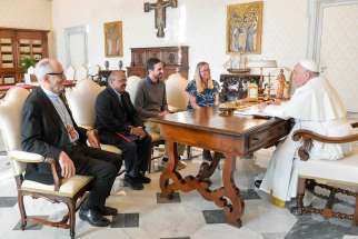 Pope Francis meets with leaders of the Laudato Si’ Movement in the library of the Apostolic Palace at the Vatican Nov. 6, 2023.