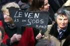 Women opposed to euthanasia are pictured in a file photo holding up a sign reading &quot;life is in God&#039;s hands&quot; during a silent demonstration in Den Bosch, Netherlands. Cardinal Willem Eijk of Utrecht, Netherlands, says the proposal to allow the euthanasia of children in the Netherlands would mark only the latest slide down the slippery slope of euthanasia.