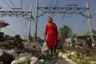 A woman carries plastic bags while browsing in 2015 at a vegetable market in Jakarta, Indonesia. Months after Indonesia&#039;s military was summoned to unclog Jakarta Bay, Archbishop Ignatius Suharyo joined a chorus of disapproval of the nation&#039;s growing plastic waste problem by calling parishioners to action. 