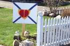 A sign outside an east end Toronto home expresses the sentiments of the entire nation for the 22 Nova Scotia shooting victims.