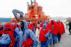 Migrants, intercepted off the coast in the Mediterranean Sea, walk after disembarking from a rescue boat Jan. 15, 2019, at the port of Malaga, Spain. Some 170 migrants were believed to have drowned in the sea in two separate shipwrecks in mid-January. &quot;They were seeking a future&quot; and &quot;perhaps were victims of human trafficking,&quot; Pope Francis said during his Angelus prayer Jan. 20. 