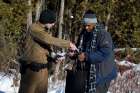 A man who claimed to be from Sudan has his and his family&#039;s passports checked by a U.S. border patrol officer Feb. 17 at the U.S.-Canada border. 