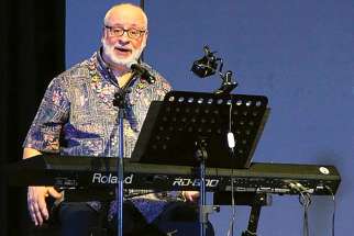 Catholic composer David Haas is shown in a concert at the Ateneo de Manila University in Quezon City, Philippines, in this 2016 photo.