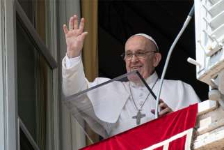 Pope Francis greets the crowd as he leads the Angelus from the window of his studio overlooking St. Peter&#039;s Square at the Vatican Aug. 1, 2021. In his Angelus message, the pope said people should seek Jesus out of genuine love, not calculated self-interest.